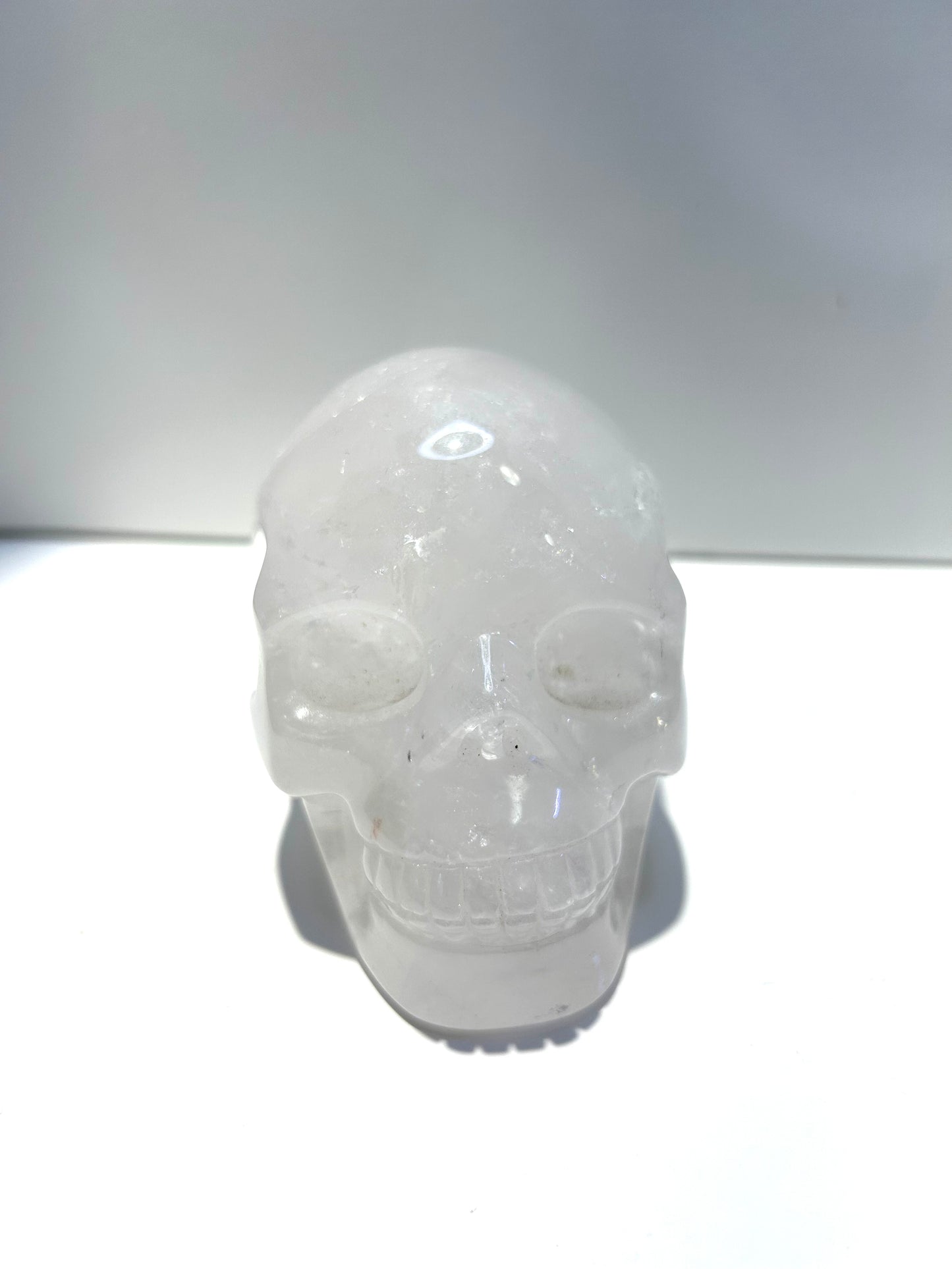 Large Clear Quartz Skull Carving With Rainbow Inclusions Statement Piece