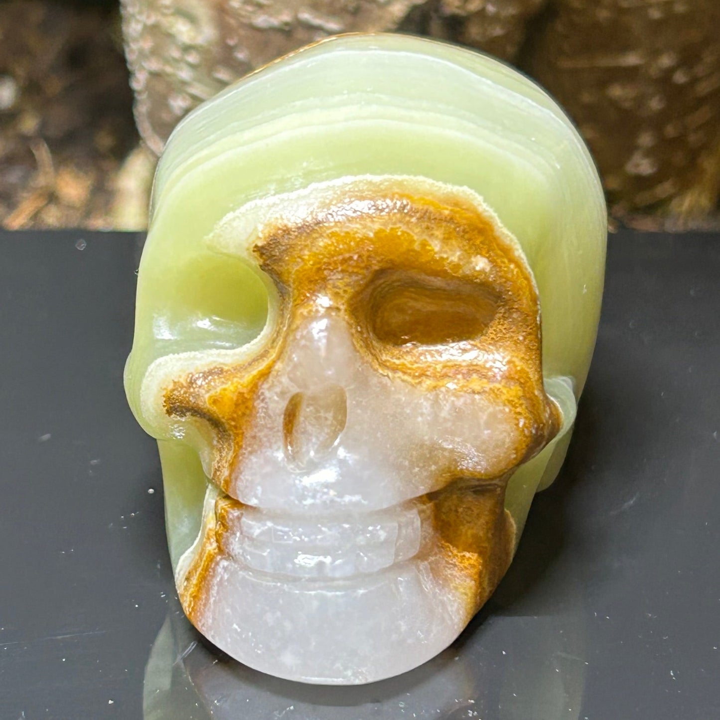 Green banded calcite Skull Carving