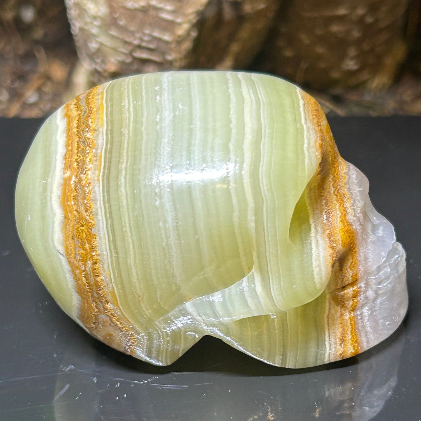 Green banded calcite Skull Carving